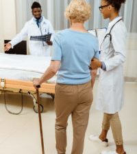 woman with cane, hip replacement