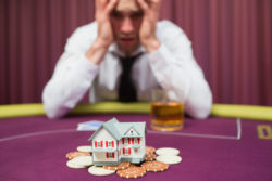 Man is betting his house at poker game in casino