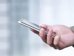 hand holding a cellphone.