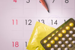 Birth control pills on calendar