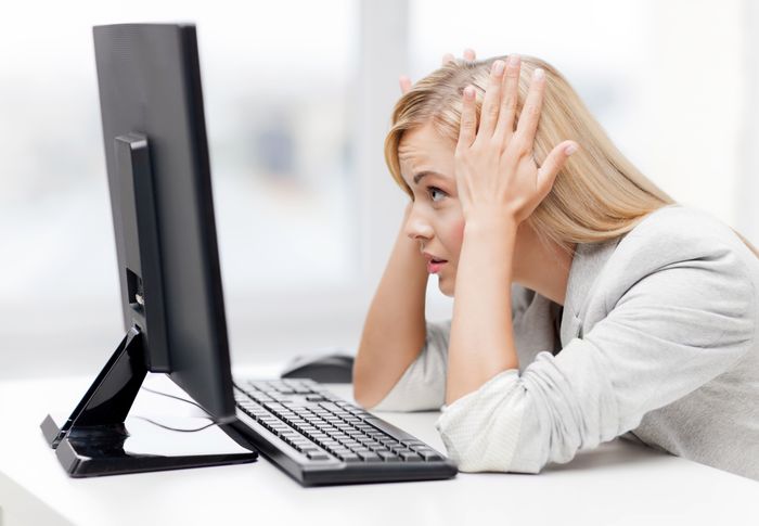picture of stressed businesswoman with computer at work