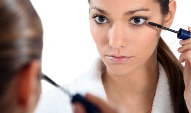 Rodan and Fields Lash Boost Woman applying eye make-up