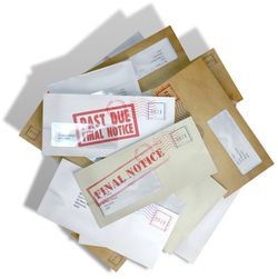 A scattered stack of regular envelopes with delivery stamps and a clear window and the top pink one saying payment due symbolizing bills and debt on an isolated white background