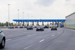 electronic toll road fees cars approaching toll booth