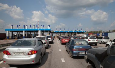 electronic toll road violation fees cars waiting for toll booth