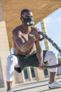 TrainingMask exercise mask altitude mask man training with ropes and mask