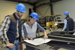 Industrial people meeting together in factory