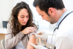 Zostavax vaccine woman getting vaccination