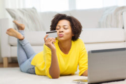 Tempur Sealy data breach woman with credit card and laptop