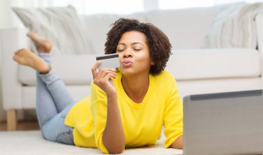 Tempur Sealy data breach woman with credit card and laptop