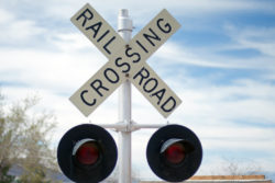railroad crossing sign on tracks