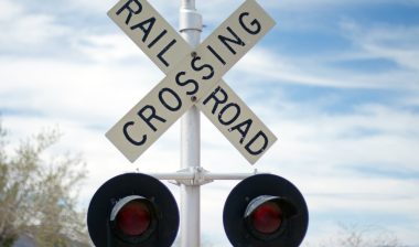 railroad crossing sign on tracks