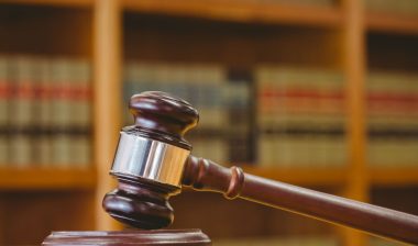 Gavel on sounding block in law library, illustrating nursing home bed sores lawsuit