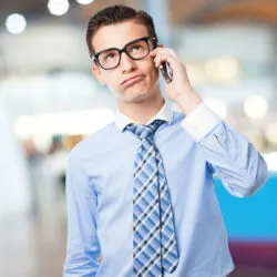 Man losing patience on phone, illustrating Verizon lawsuit