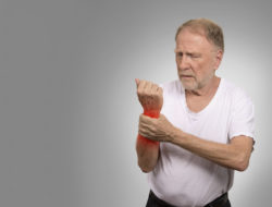 older man suffering side effects of Uloric