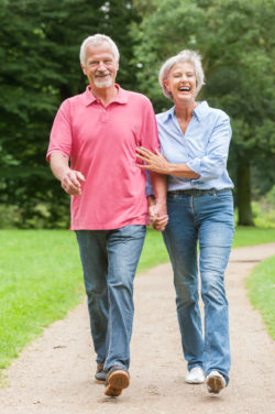 Couple walking, illustration of Stryker femoral heads