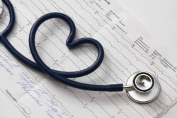 Stethoscope on medical billing records, illustrating overbilling Medicare