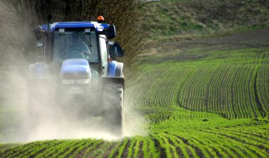 Tractor plowing farmland while Roundup cancer lawsuits are pending