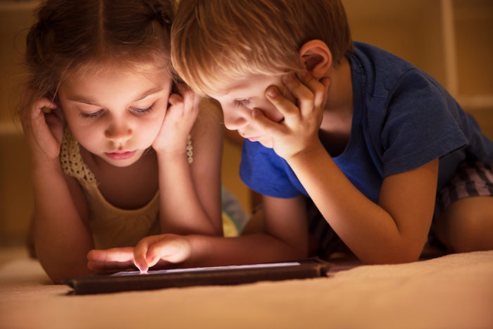 little kids watching shows on tablet