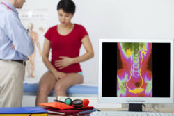 A woman visits doctors office with Hernia Mesh Infection Symptoms