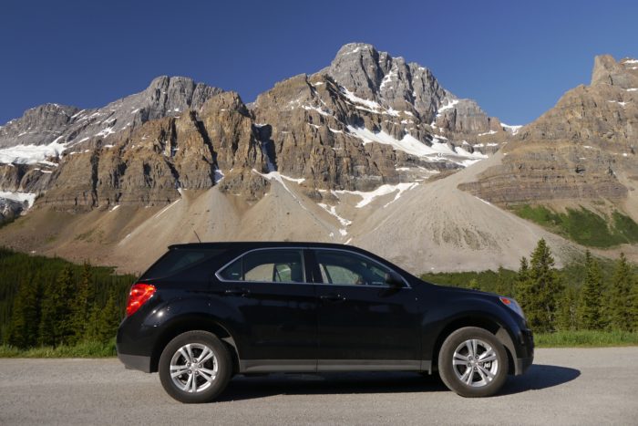 chevy equinox suv on road near mountain