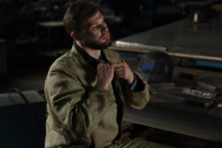 man in factory facing risk of occupational asbestos exposure