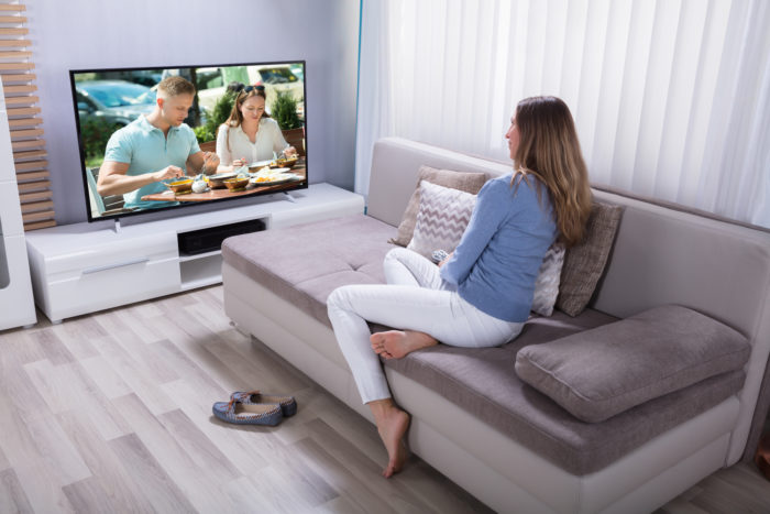 woman watching spectrum cable television