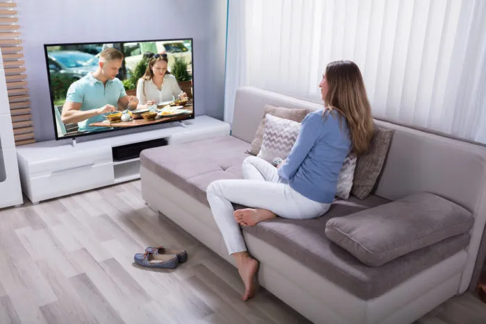 woman watching spectrum cable television
