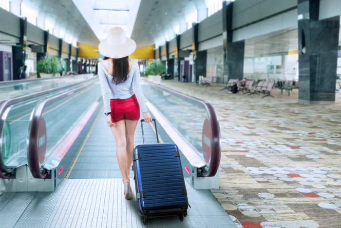 spirit airlines traveler with luggage