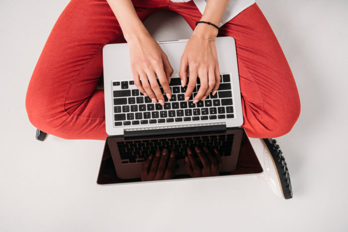 computer on bed, woman working