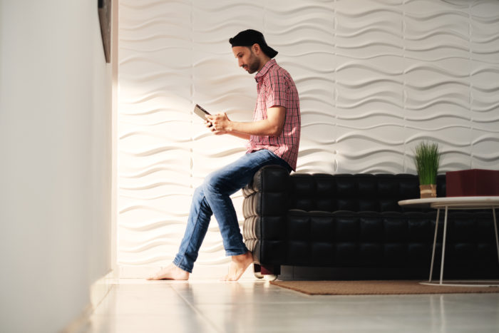 man watching A&E network on tablet
