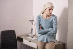 woman upset over chemotherapy alopecia