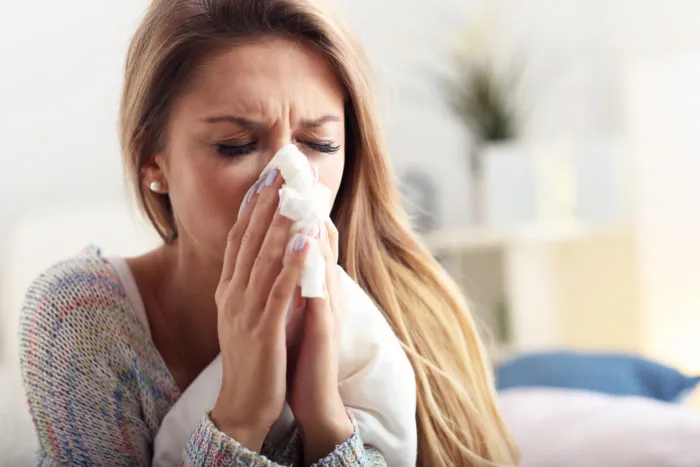 woman using Zicam cold products