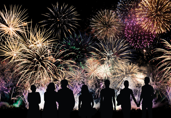 family friends watching fireworks on display