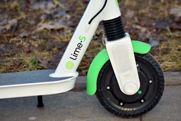 close up of a lime branded electric scooter
