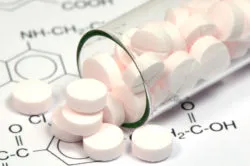 Antibiotics spilling from jar