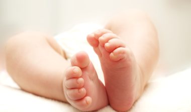 close up of baby feet which could be wrapped in an Owlet Smart Sock