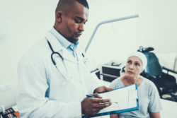 Doctor with cancer patient.