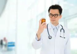Doctor with pill bottle