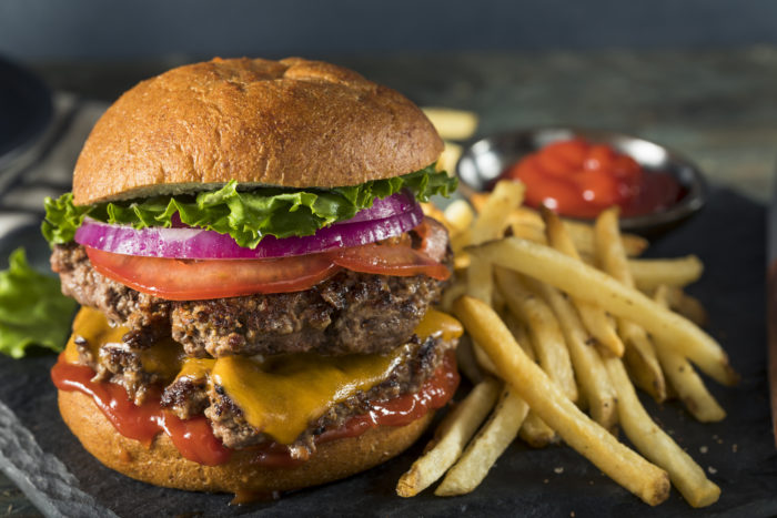 smashburger triple double hamburger with cheese and fries on the side
