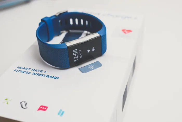fitbit charge 2 fitness band on top of packaging