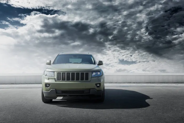 jeep grand cherokee manufactured by Fiat Chrysler with clouds in the background