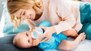 mom feeding baby Gerber good start infant formula