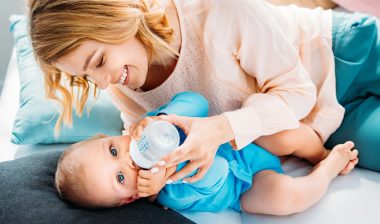 mom feeding baby Gerber good start infant formula