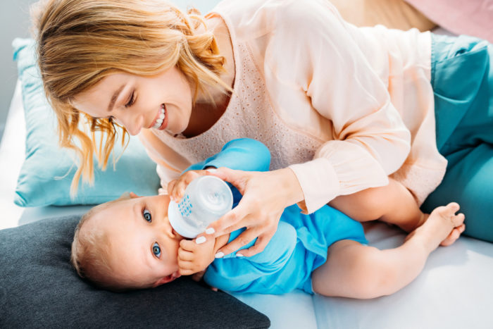 mom feeding baby Gerber good start infant formula