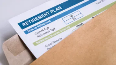 Retirement Planning letter in brown envelope opening, business concept - cerner