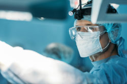 Surgeon in surgical gear in operating room