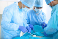Doctors doing surgery.
