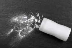 White talcum powder on a black background