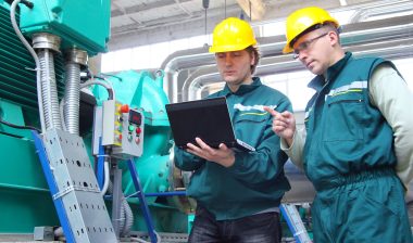 Two workers in a chemical plant